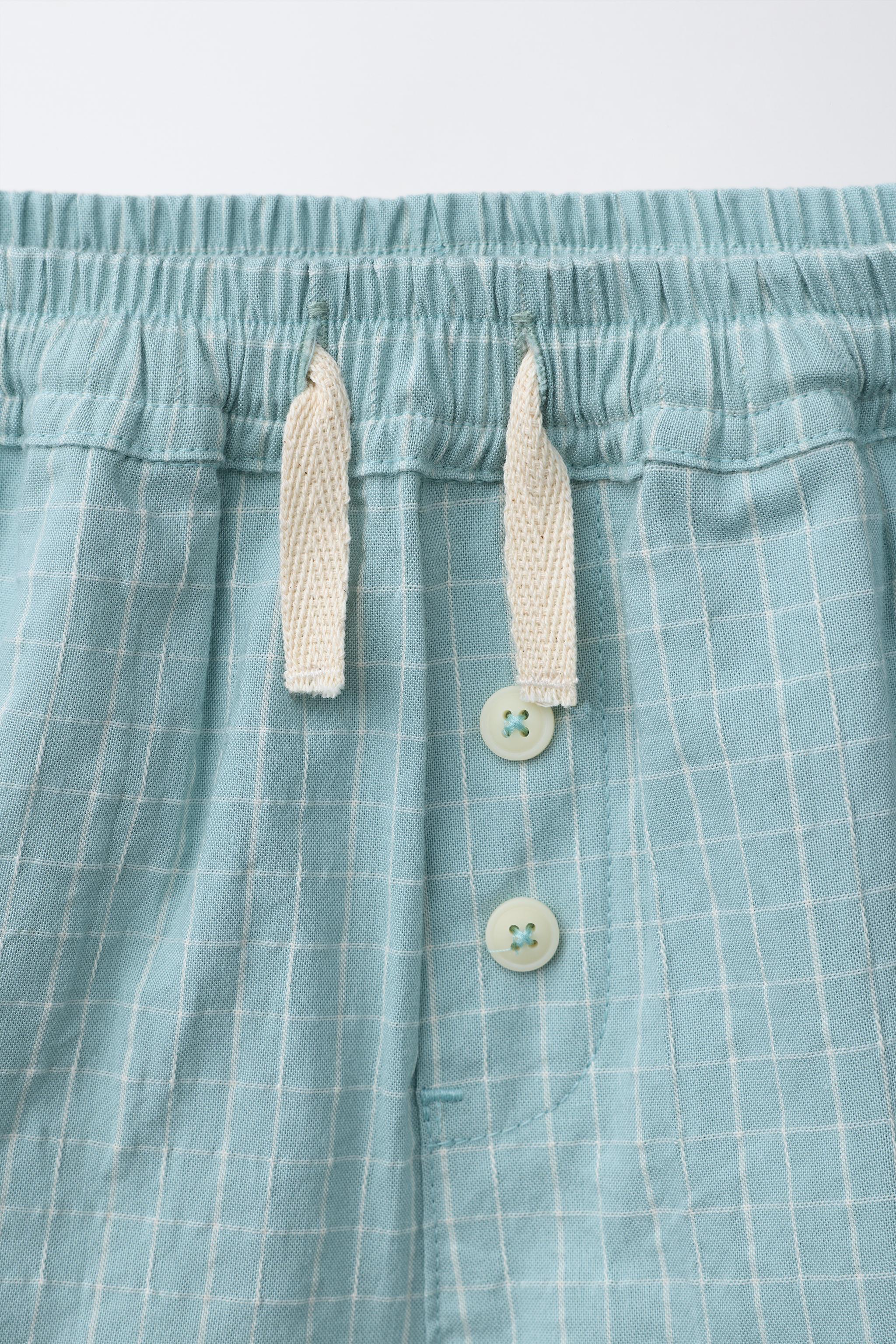 BUTTONED PLAID SHORTS